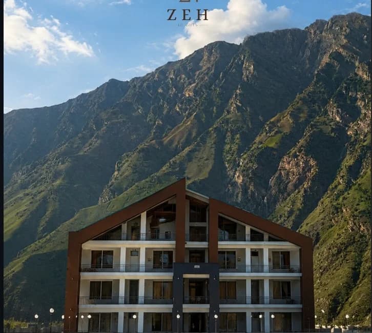 ZEH Heights hotel by day against the mountains